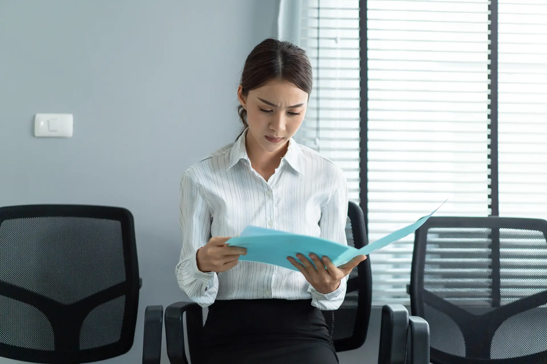 Asian beautiful woman applicant sit on lined up chair, prepare for job interview in corporate