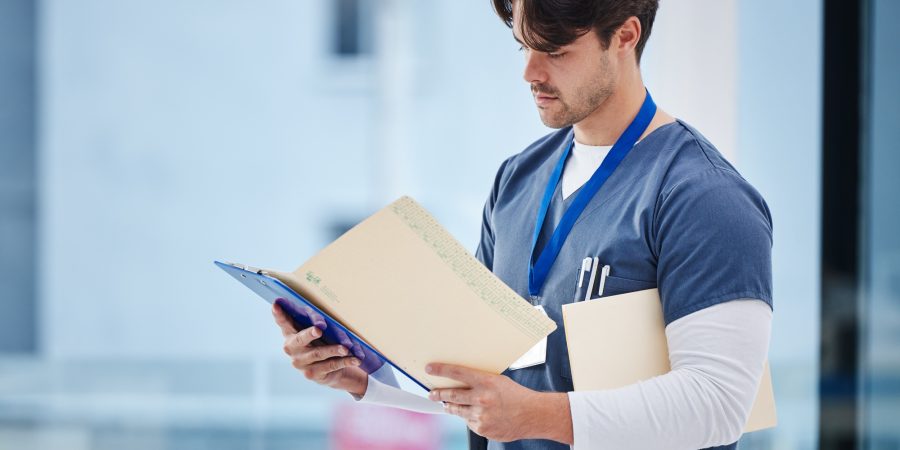 Hospital folder, doctor and man reading documents, healthcare records or clinic information. Wellne